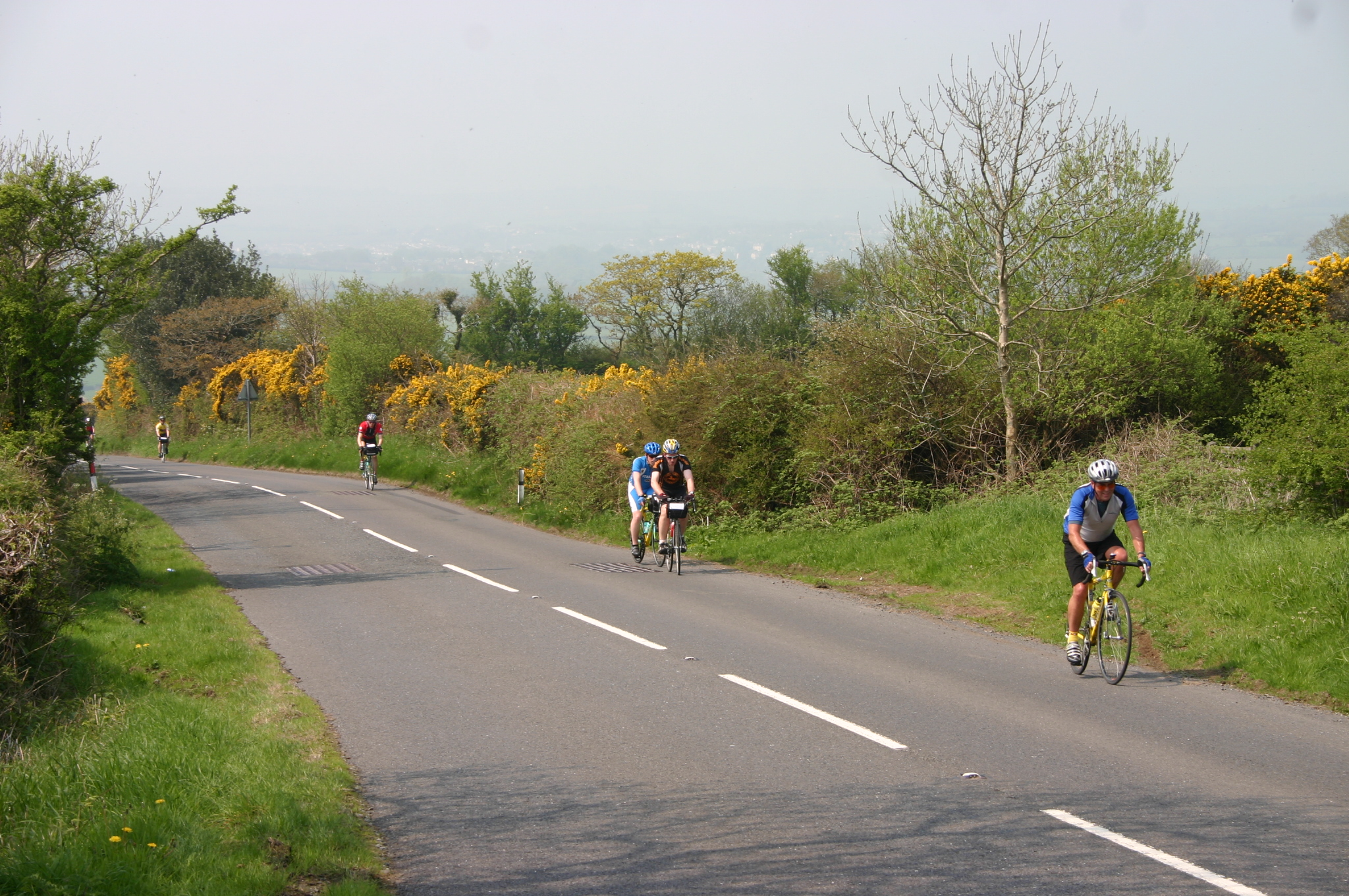 Group of cyclists on the road taking part in the London to Bruges cycle challenge