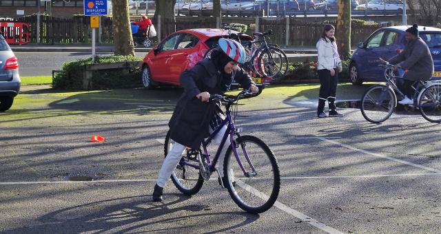 Teaching an adult top to ride a bike