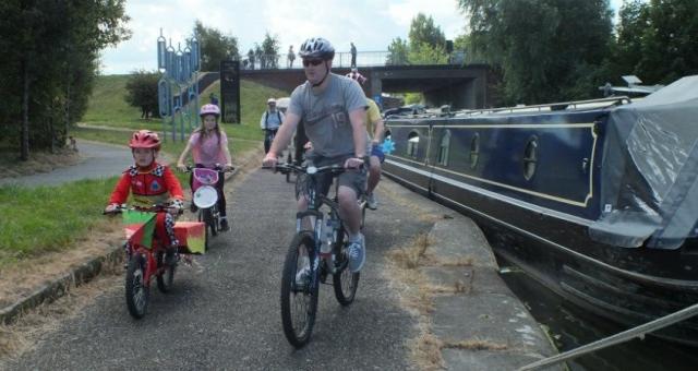 Family riding canalside