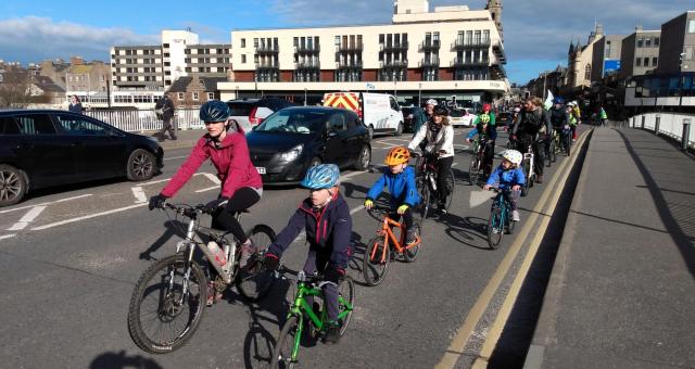 Kidical Mass ride through Inverness in March 2022