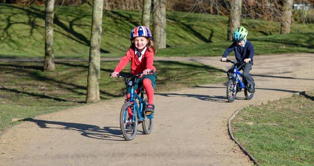 Two children on a cycle path in Surrey