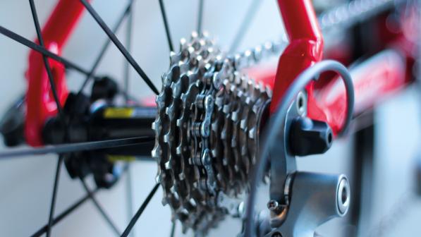 Close up of rear bike cassette, showing multiple cogs