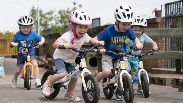 A group of four children on balance bikes © Gibson Digital 2022