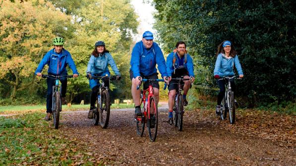 Cyclists riding in autumn