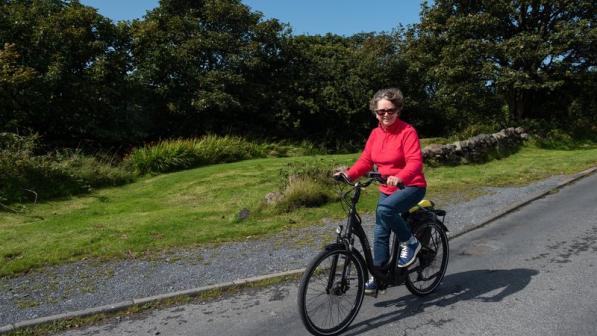 woman cycling in rural area